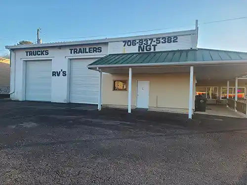 Tire and service shop with garage bays for trucks, trailers, and RVs, located at Tire Discounters.