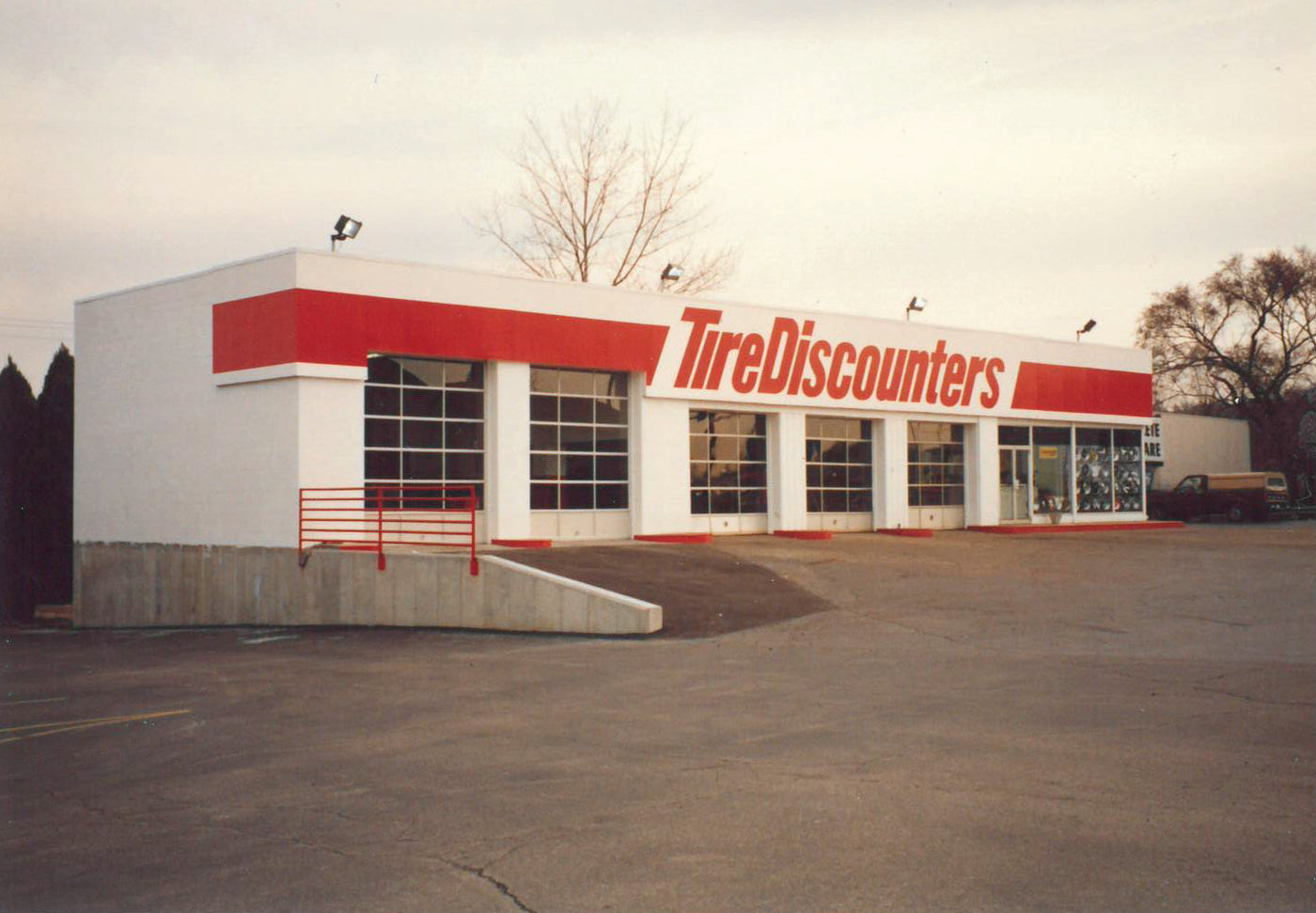 Building with 'Tire Discounters' signage on a snowy day