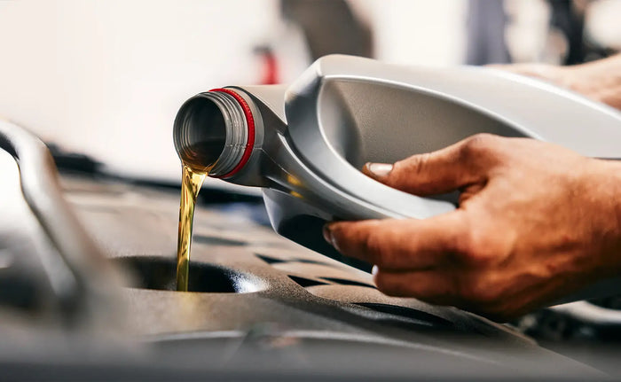 Close-up of oil being poured—Tire Discounters provides fast, full-service oil changes to keep your engine running smoothly.