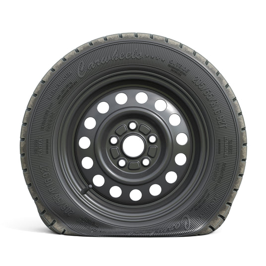 Black steel car wheel with a visibly flat all-season tire, showing deflated sidewall and loss of air pressure.