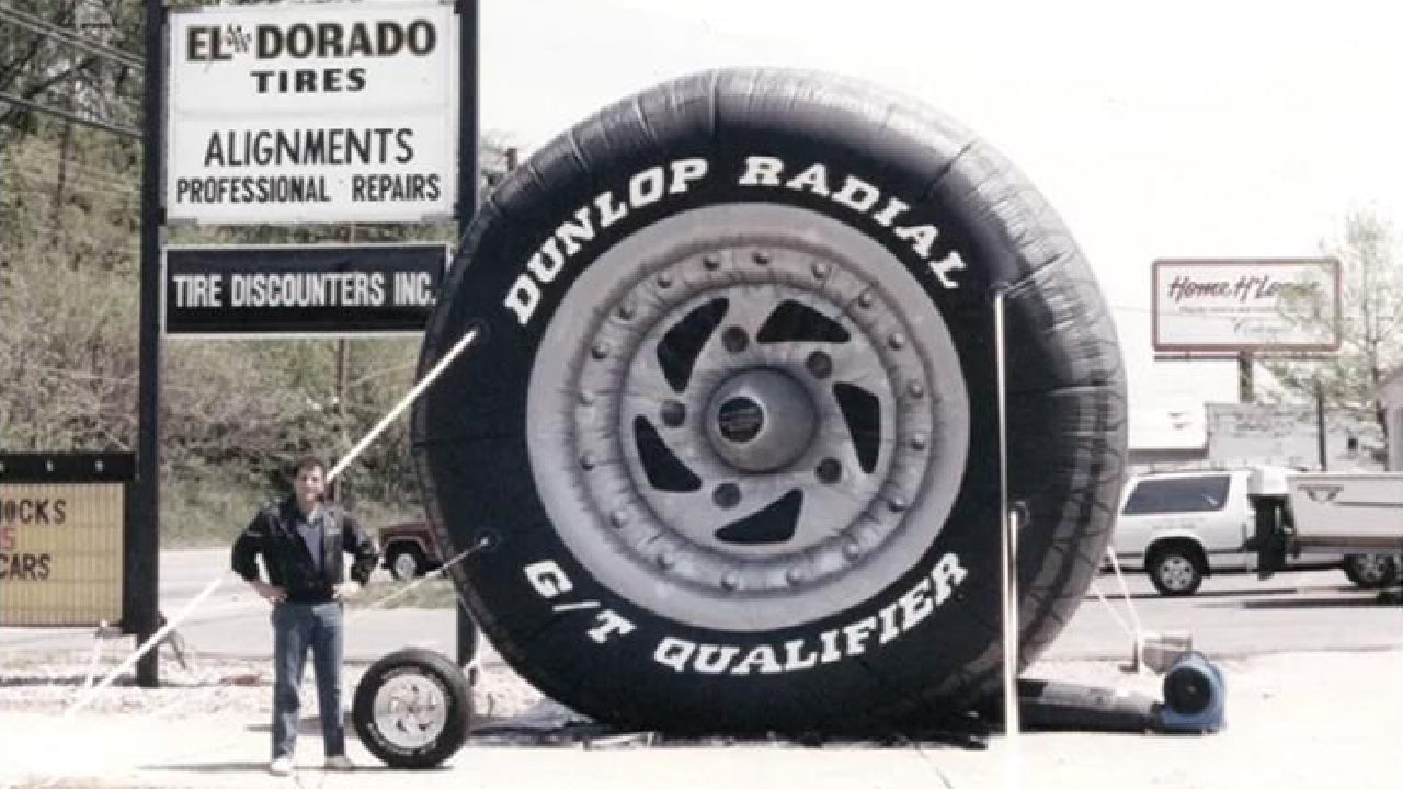 Early Tire Discounters location featuring a giant tire display outside the store
