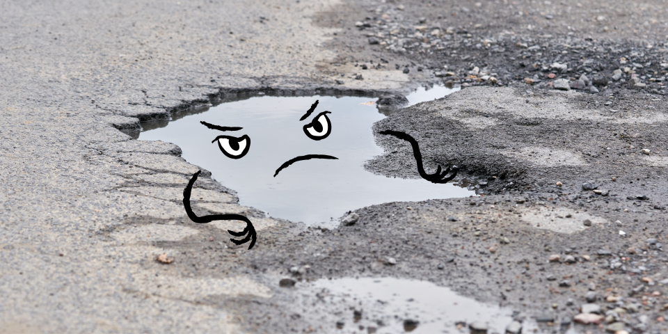 Water-filled pothole with an angry cartoon face, showing how winter potholes damage tires and suspension