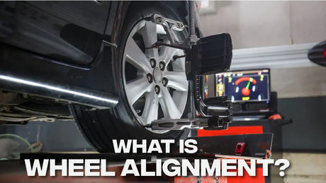 What is Wheel Alignment? Picture of car getting an alignment.