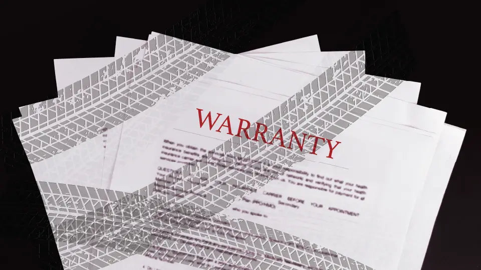Warranty papers with tire marks on them