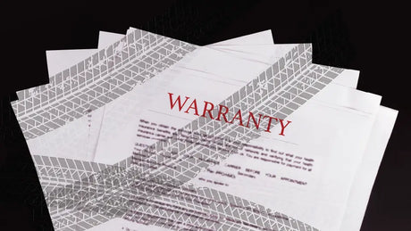 Warranty papers with tire marks on them