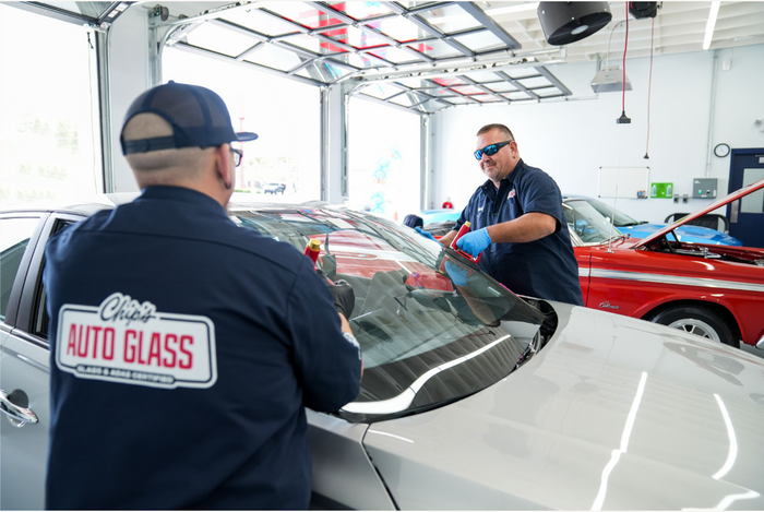 Certified Chip’s Auto Glass technicians performing professional windshield replacement in-shop — trusted auto glass service near you.