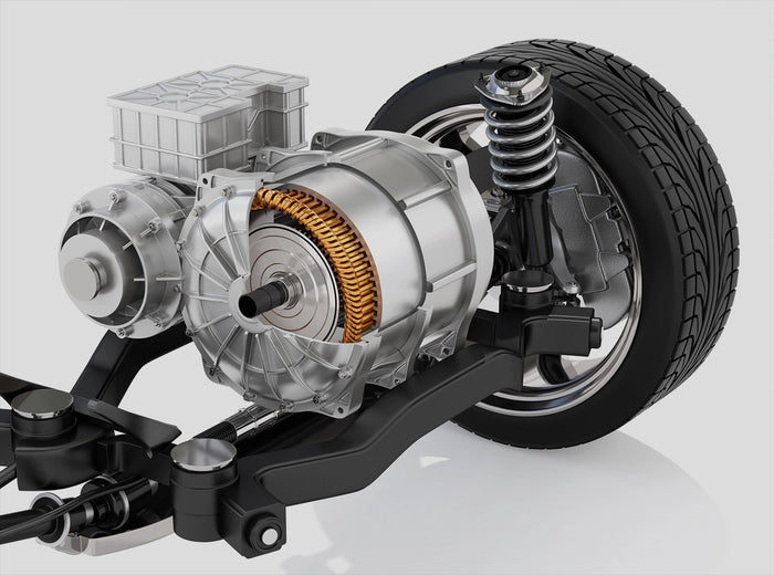 Close-up of electric vehicle powertrain and suspension system with tire and motor assembly. 