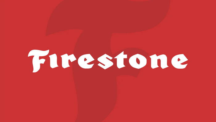 Firestone logo on bold red background, representing a legacy brand in durable tires for cars, trucks, and performance driving since 1900.