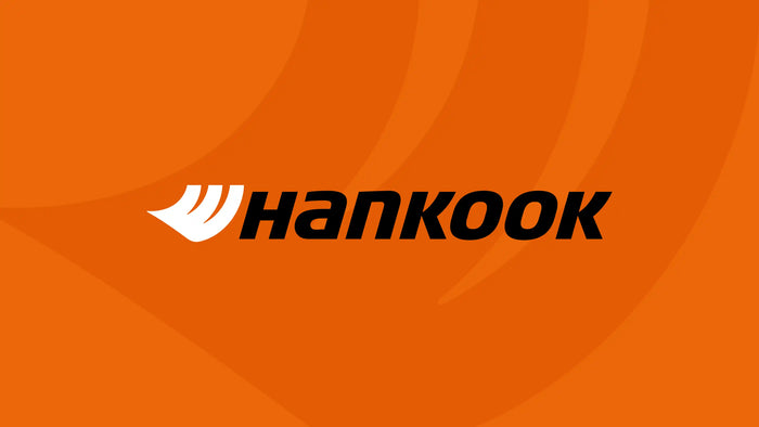 Hankook Tires logo on bright orange background, representing a global leader in high-performance tires for cars, trucks, and commercial vehicles.