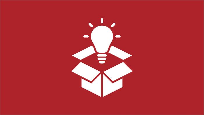 Box with glowing light bulb icon representing Tire Discounters innovation in car care and auto repair