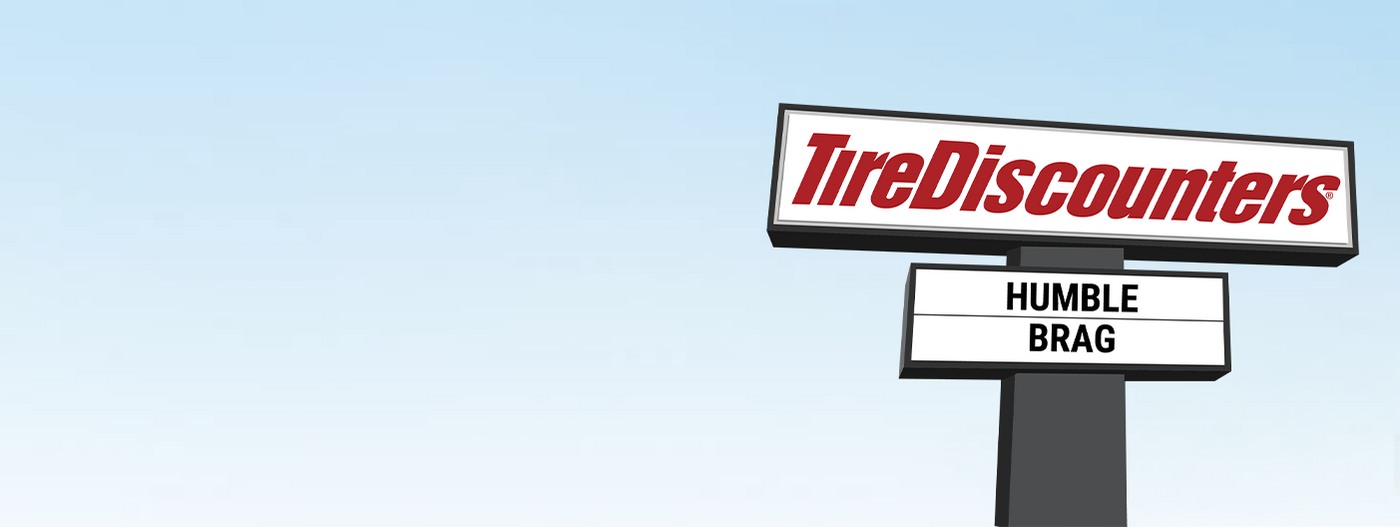 Illustration of a Tire Discounters road sign under a blue sky, with the marquee message reading "HUMBLE BRAG".