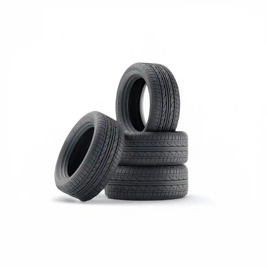 Stack of four new all-season car tires on white background — shop premium tire deals at Tire Discounters today.