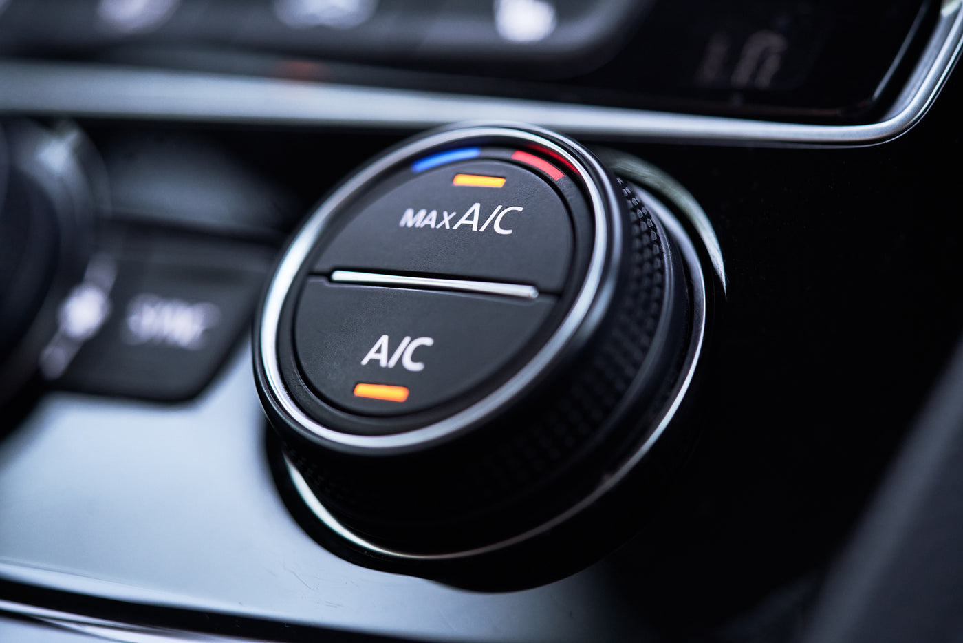 Close-up of vehicle A/C control dial — keep your car cool with professional air conditioning service at Tire Discounters.